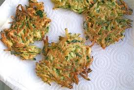 Zucchini fritters draining on paper towels